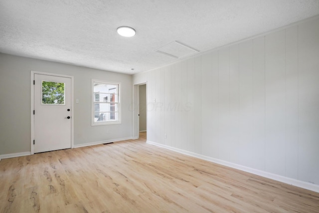 1358 Moler Rd, Columbus, OH 43207 - entryway featuring wood finished floors and a textured ceiling