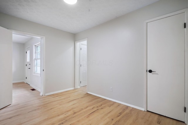 1358 Moler Rd, Columbus, OH 43207 - spare room with wood finished floors and baseboards