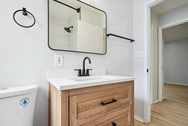 1358 Moler Rd, Columbus, OH 43207 - bathroom featuring vanity and wood finished floors
