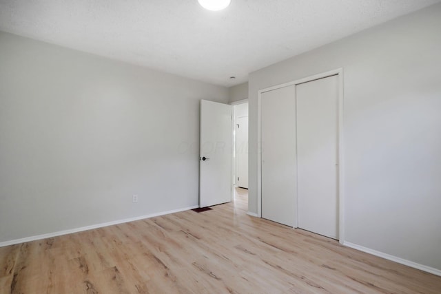 1358 Moler Rd, Columbus, OH 43207 - unfurnished bedroom featuring wood finished floors and a closet