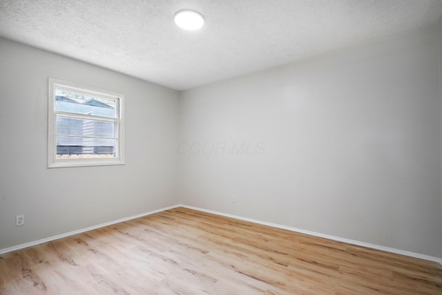1358 Moler Rd, Columbus, OH 43207 - unfurnished room with wood finished floors and a textured ceiling