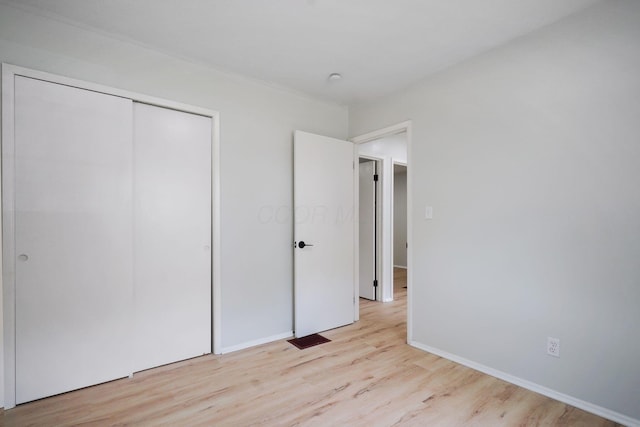 1358 Moler Rd, Columbus, OH 43207 - unfurnished bedroom featuring wood finished floors and a closet
