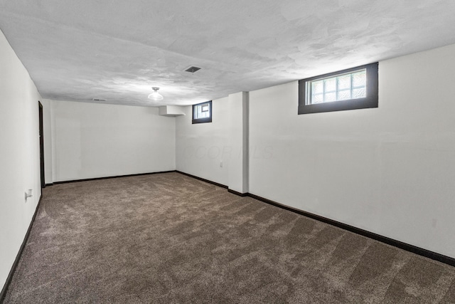 1861 Berkeley Rd, Columbus, OH 43207 - basement featuring carpet, healthy amount of natural light, and a textured ceiling