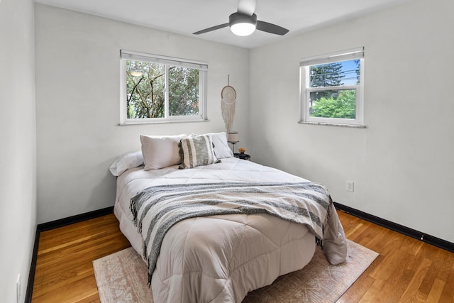 1861 Berkeley Rd, Columbus, OH 43207 - bedroom with multiple windows, wood finished floors, and ceiling fan