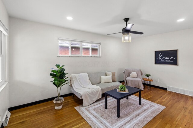 1861 Berkeley Rd, Columbus, OH 43207 - living room featuring wood finished floors, a ceiling fan, recessed lighting, and a baseboard radiator