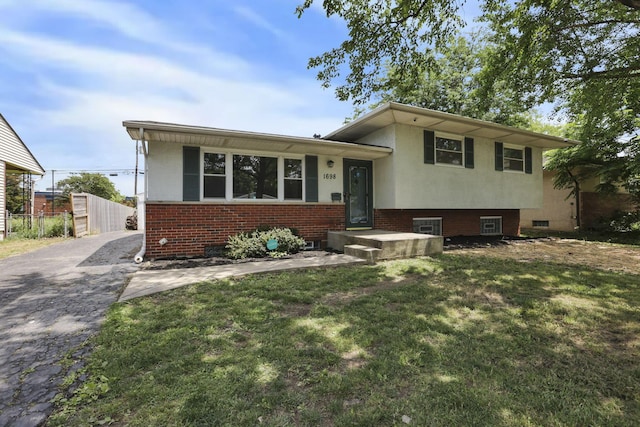 1698 Woodcrest Rd, Columbus, OH 43232 - split level home with driveway, brick siding, and stucco siding