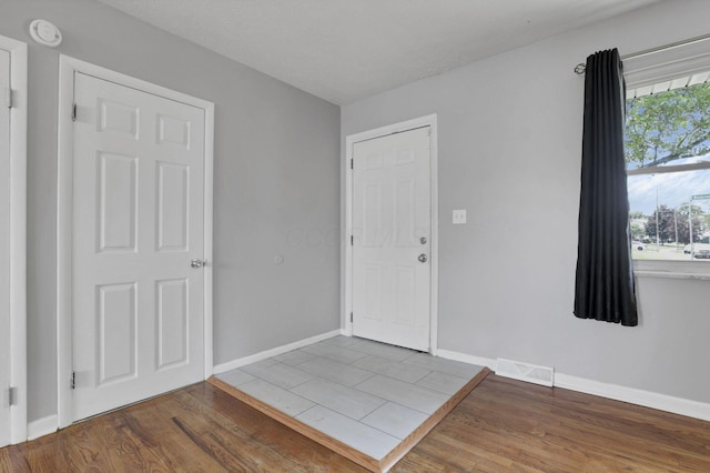 1698 Woodcrest Rd, Columbus, OH 43232 - entrance foyer with wood finished floors and baseboards
