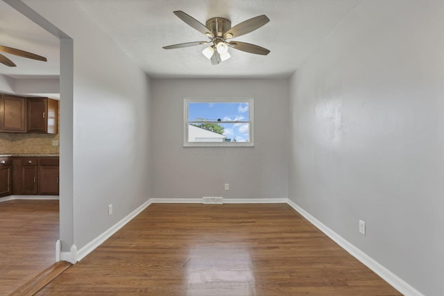 1698 Woodcrest Rd, Columbus, OH 43232 - spare room with a ceiling fan and wood finished floors