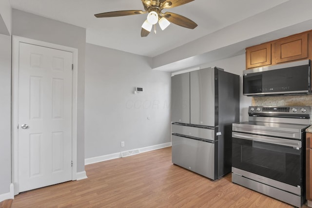 1698 Woodcrest Rd, Columbus, OH 43232 - kitchen featuring stainless steel appliances, light wood-type flooring, a ceiling fan, brown cabinetry, and backsplash