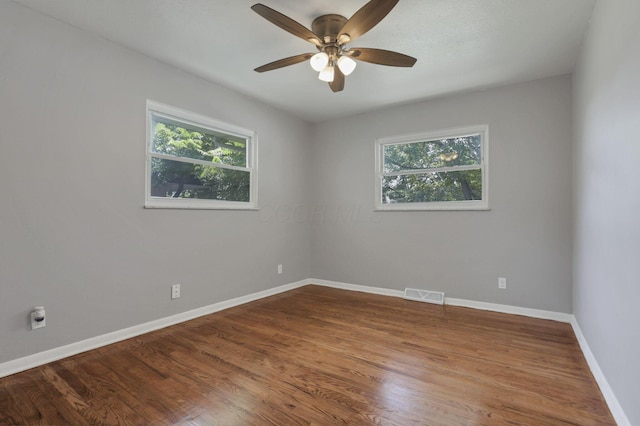 1698 Woodcrest Rd, Columbus, OH 43232 - empty room with healthy amount of natural light, ceiling fan, and wood finished floors