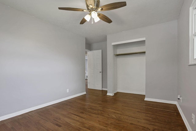 1698 Woodcrest Rd, Columbus, OH 43232 - unfurnished bedroom with dark wood-type flooring, a closet, and ceiling fan