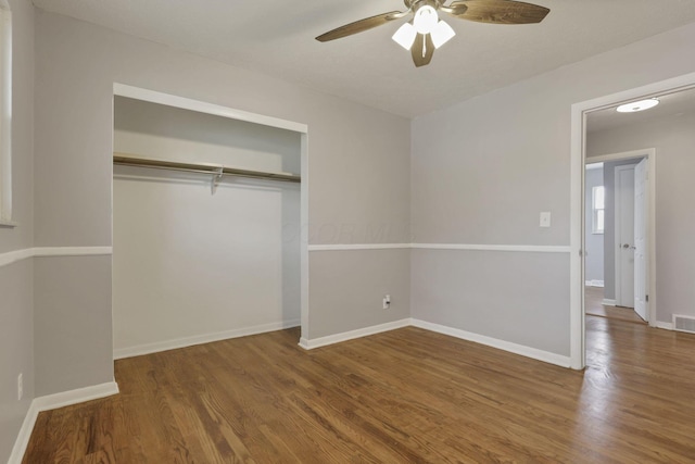 1698 Woodcrest Rd, Columbus, OH 43232 - unfurnished bedroom featuring wood finished floors, a closet, and a ceiling fan