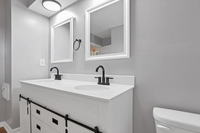 1698 Woodcrest Rd, Columbus, OH 43232 - bathroom featuring toilet and double vanity