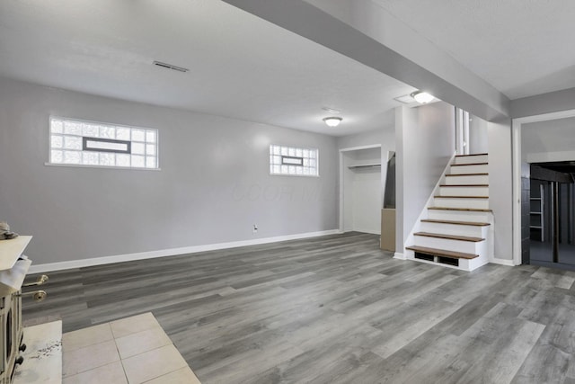 1698 Woodcrest Rd, Columbus, OH 43232 - basement with stairs and wood finished floors