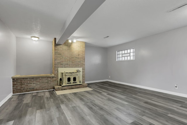 1698 Woodcrest Rd, Columbus, OH 43232 - unfurnished living room with wood finished floors and a fireplace