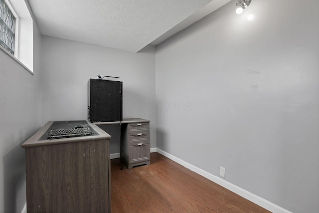 1698 Woodcrest Rd, Columbus, OH 43232 - unfurnished office featuring dark wood-style floors and a textured ceiling