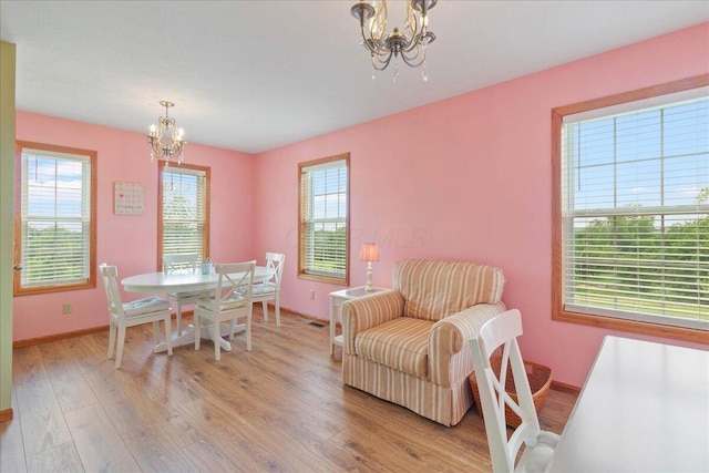 6171 State Route 245, North Lewisburg, OH 43060 - dining room featuring a chandelier, light wood-style flooring, and healthy amount of natural light
