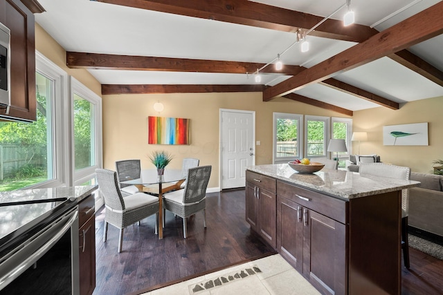 2474 Bristol Rd, Columbus, OH 43221 - kitchen with dark brown cabinetry, healthy amount of natural light, open floor plan, and light stone counters