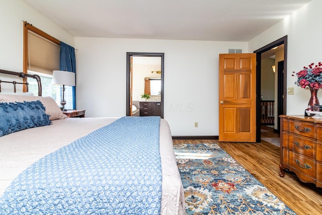 1163 Sitterley Rd NW, Canal Winchester, OH 43110 - bedroom featuring wood finished floors and ensuite bathroom