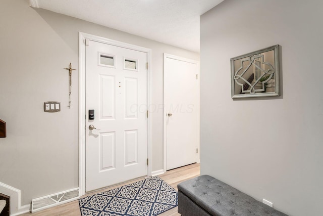 5092 Schuylkill St Unit 31-92, Columbus, OH 43220 - foyer entrance with light wood-type flooring and baseboards