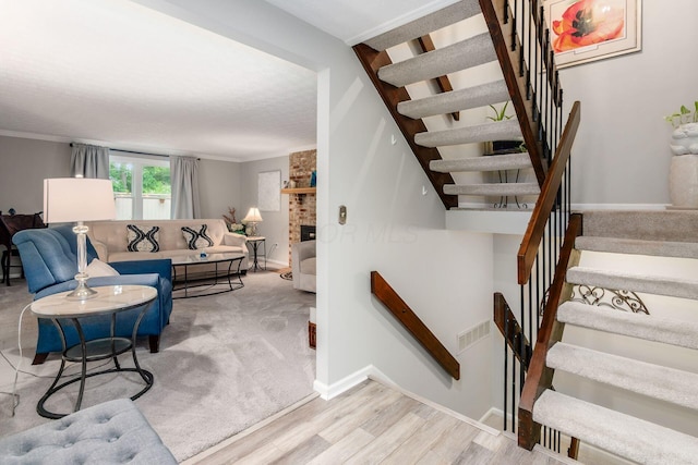5092 Schuylkill St Unit 31-92, Columbus, OH 43220 - staircase featuring wood finished floors and ornamental molding