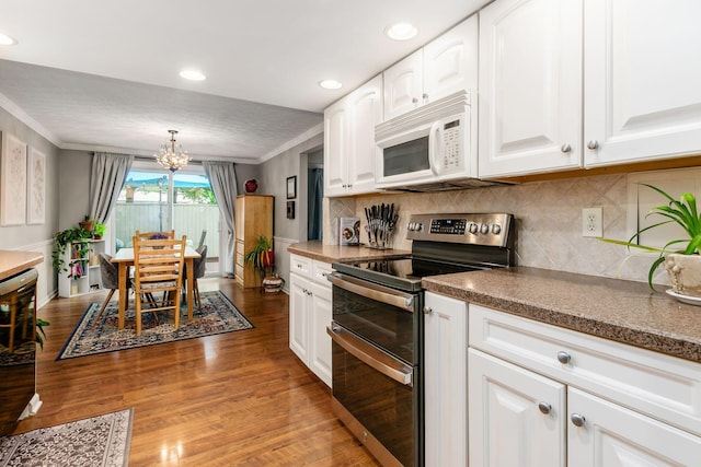 5092 Schuylkill St Unit 31-92, Columbus, OH 43220 - kitchen featuring range with two ovens, white microwave, ornamental molding, a chandelier, and light wood-style flooring