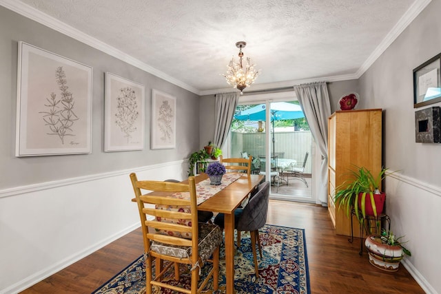 5092 Schuylkill St Unit 31-92, Columbus, OH 43220 - dining space with dark wood finished floors, a chandelier, a textured ceiling, and ornamental molding