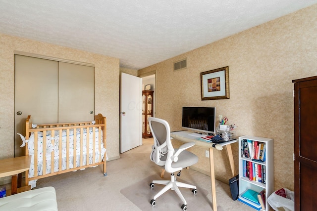5092 Schuylkill St Unit 31-92, Columbus, OH 43220 - carpeted bedroom with a closet, a desk, and a textured ceiling