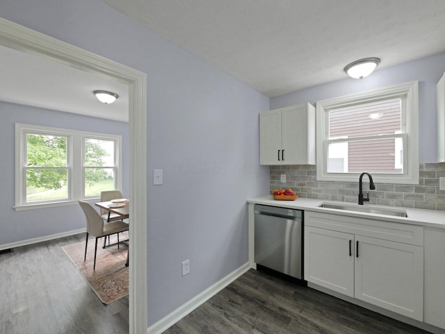 315 S Southampton Ave, Columbus, OH 43204 - kitchen with stainless steel dishwasher, dark wood finished floors, decorative backsplash, and light countertops