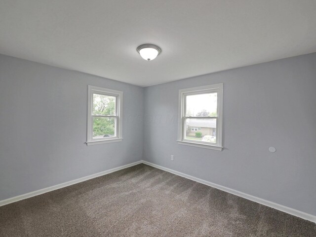 315 S Southampton Ave, Columbus, OH 43204 - empty room with baseboards and dark colored carpet