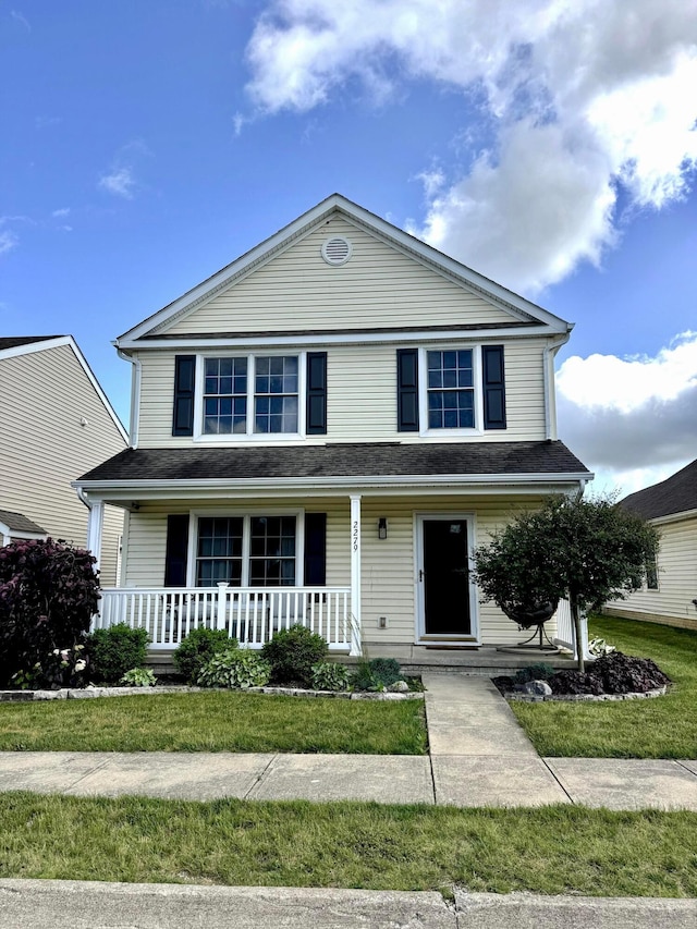 2279 Dunvegan St, Marion, OH 43302 - traditional-style home featuring covered porch and a front yard