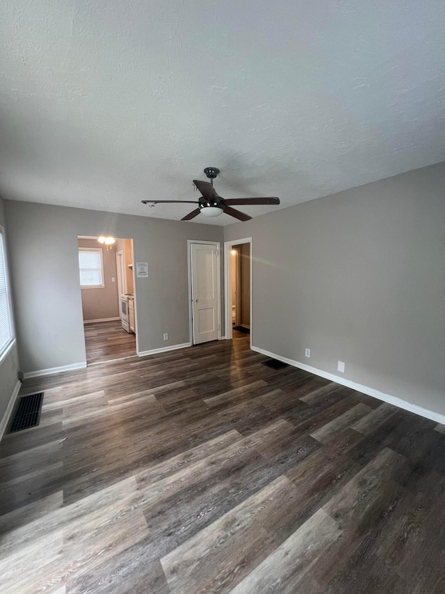 2769 Mcguffey Rd, Columbus, OH 43211 - spare room featuring wood finished floors, a ceiling fan, and a textured ceiling