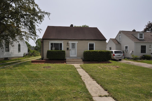 1097 Oakland Park Ave, Columbus, OH 43224 - cape cod home with a front yard and driveway
