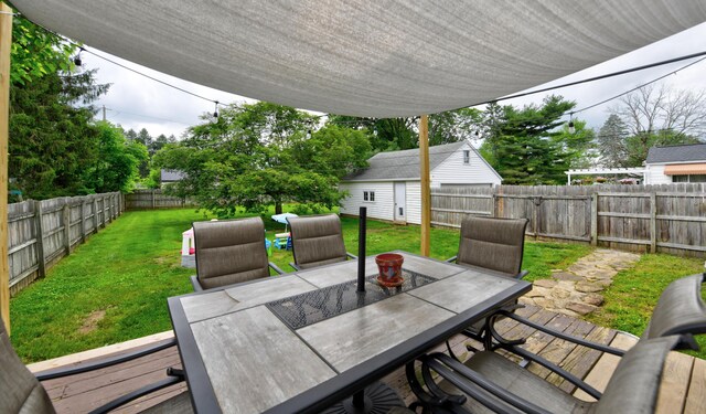 175 Pierson Blvd, Newark, OH 43055 - fenced backyard with outdoor dining area and an outbuilding