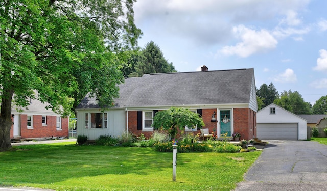 175 Pierson Blvd, Newark, OH 43055 - cape cod house featuring an outbuilding, brick siding, a detached garage, and a front lawn