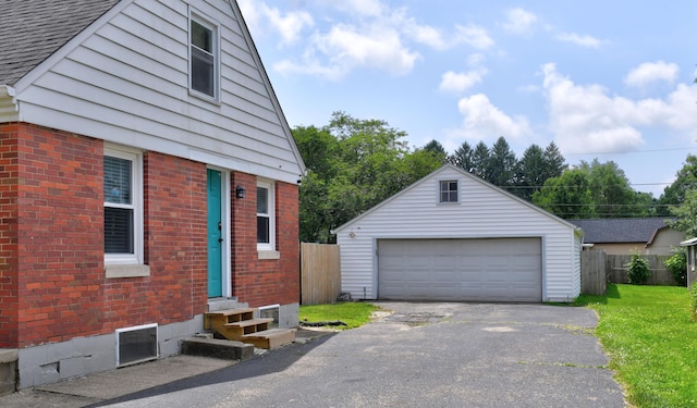 175 Pierson Blvd, Newark, OH 43055 - view of home's exterior with entry steps, brick siding, a detached garage, and an outdoor structure