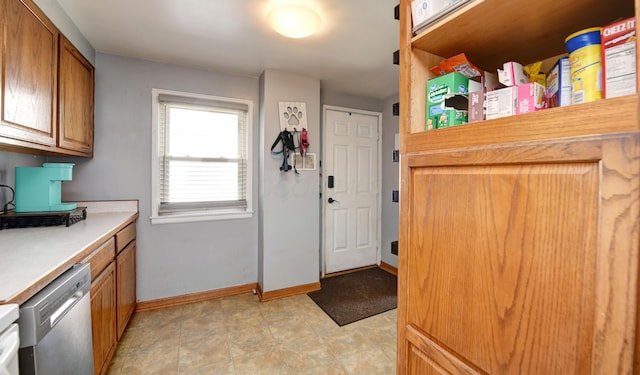 175 Pierson Blvd, Newark, OH 43055 - kitchen with dishwasher, light countertops, and brown cabinets