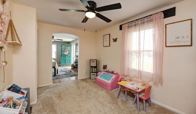 175 Pierson Blvd, Newark, OH 43055 - playroom with a ceiling fan, carpet, and arched walkways