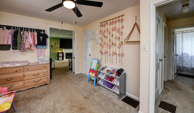 175 Pierson Blvd, Newark, OH 43055 - carpeted bedroom with a fireplace and a ceiling fan