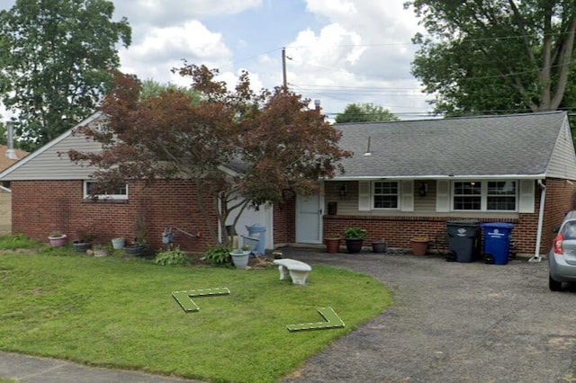 1628 Lucks Rd, Reynoldsburg, OH 43068 - bungalow-style home featuring brick siding, a front lawn, and roof with shingles