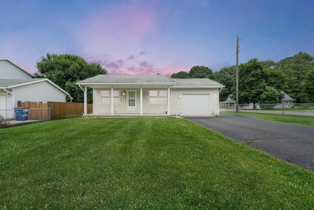 1138 Ohio Ave, Logan, OH 43138 - view of front of home featuring driveway, an attached garage, and covered porch