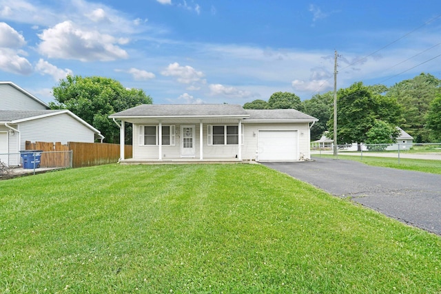 1138 Ohio Ave, Logan, OH 43138 - view of front of property with an attached garage, asphalt driveway, and covered porch