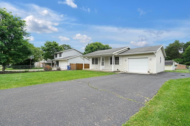 1138 Ohio Ave, Logan, OH 43138 - view of front facade with a garage and asphalt driveway