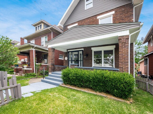 935 S Ohio Ave, Columbus, OH 43206 - traditional style home with brick siding and a porch