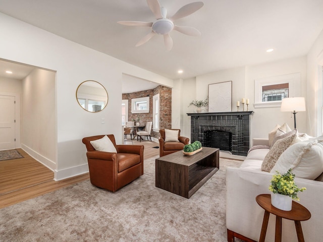 935 S Ohio Ave, Columbus, OH 43206 - living area featuring wood finished floors, a ceiling fan, a fireplace, and recessed lighting