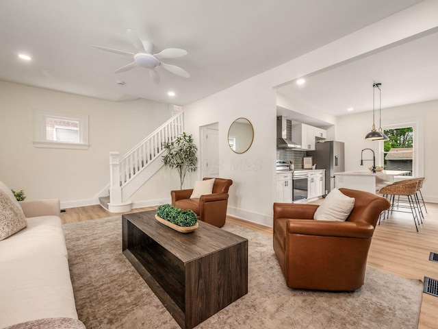 935 S Ohio Ave, Columbus, OH 43206 - living area featuring light wood-type flooring, stairway, ceiling fan, and recessed lighting