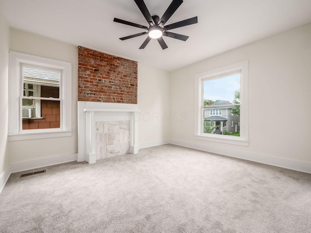 935 S Ohio Ave, Columbus, OH 43206 - unfurnished living room with plenty of natural light, ceiling fan, and carpet flooring