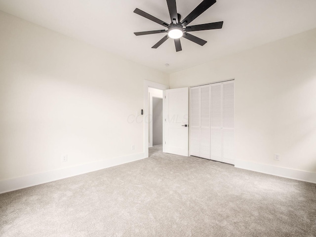 935 S Ohio Ave, Columbus, OH 43206 - unfurnished bedroom with carpet, a closet, and a ceiling fan