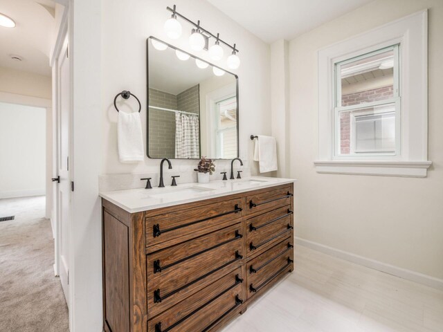 935 S Ohio Ave, Columbus, OH 43206 - full bathroom featuring double vanity and curtained shower