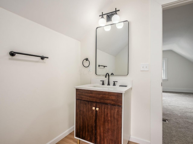 935 S Ohio Ave, Columbus, OH 43206 - bathroom with lofted ceiling and vanity